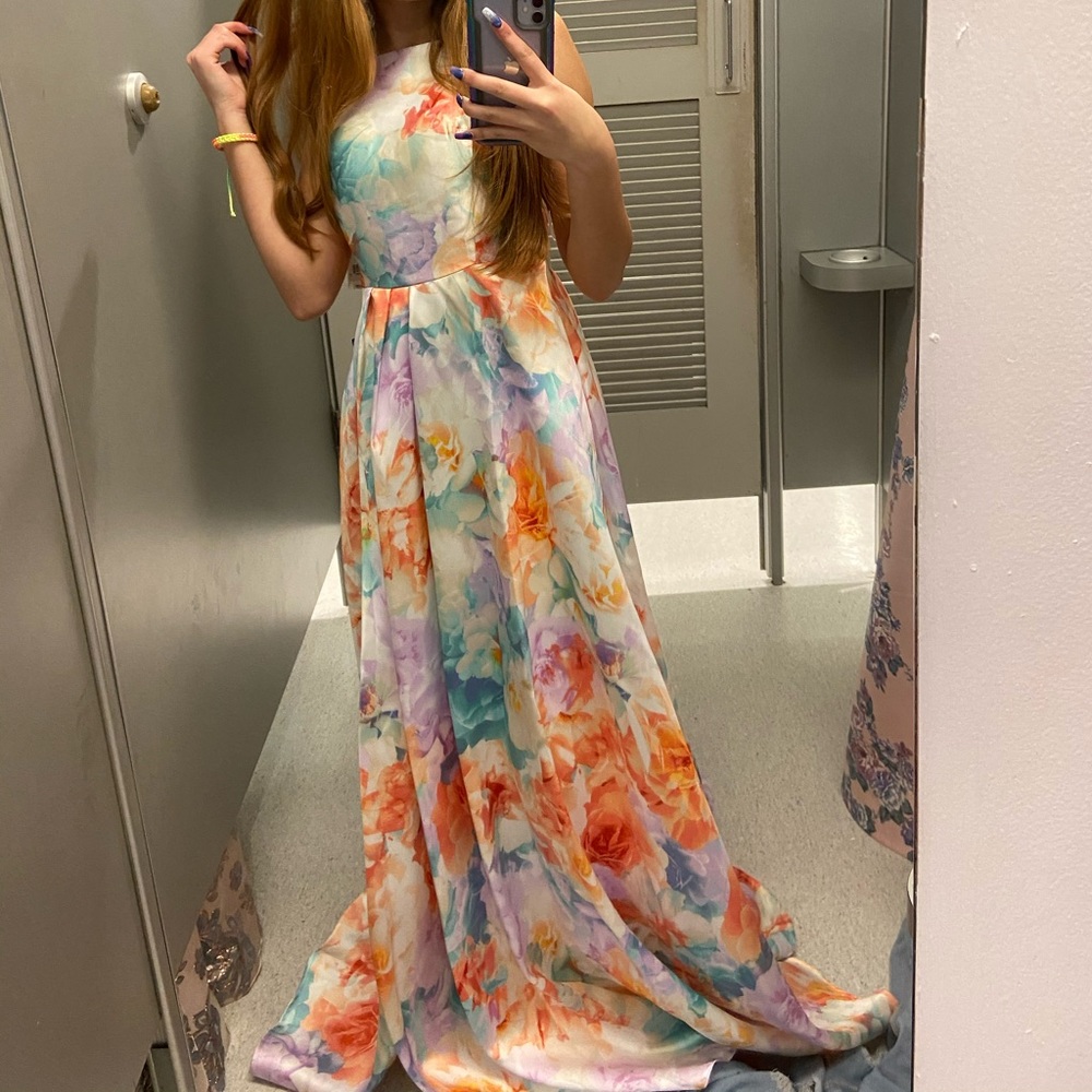 multi colored, spring formal dress with a pastel floral pattern all over.